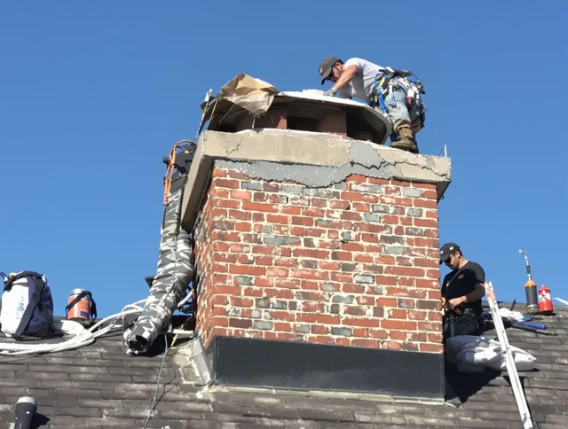 Anaheim Chimney Sweep installing a custom chimney crown in Anaheim, CA